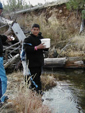 Ed collecting sample water