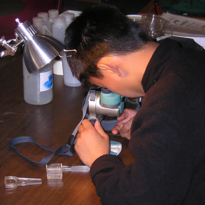 student on microscope