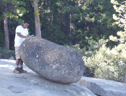 anthony by a boulder